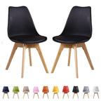 Set of 2 black retro dining chairs with cushioned seats and wooden legs