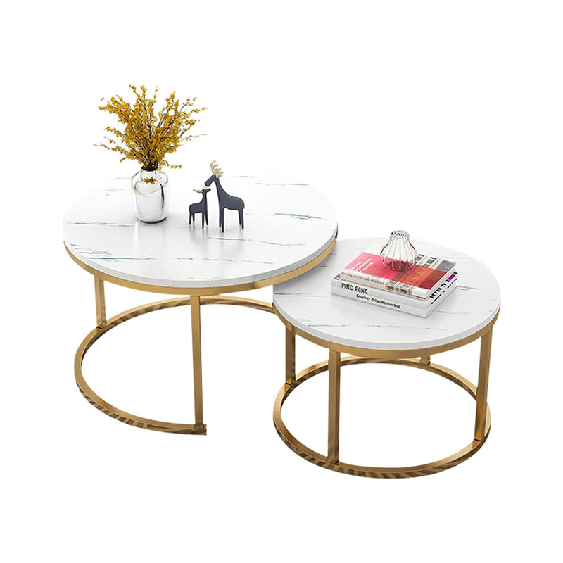 Modern round nesting coffee table set with a sleek metal frame and stone top