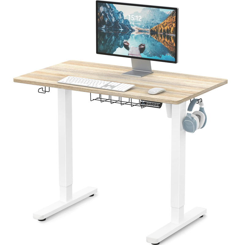 SHW Small Electric Height Adjustable Sit Stand Desk with white frame and maple top, featuring hanging hooks and cable managem