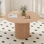 Modern round dining table with light brown wood grain and cylindrical base
