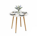 Scandinavian style round dining table with white MDF top and bamboo legs
