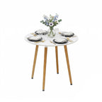 Scandinavian style round dining table with white MDF top and bamboo legs