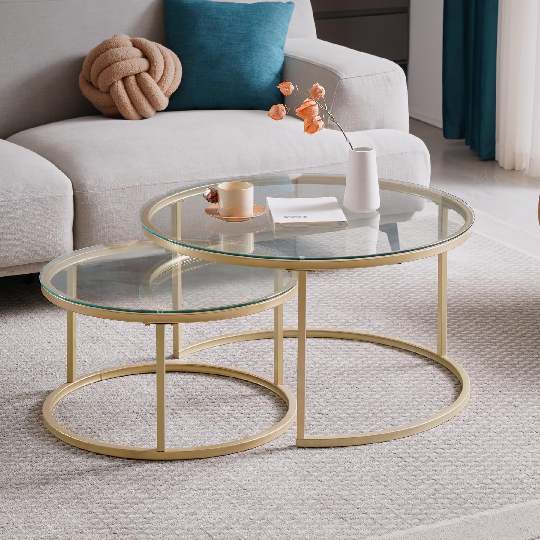 Set of 2 modern nesting coffee tables with glass top and gold finish