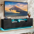 Modern black TV stand with LED lights and storage cabinets