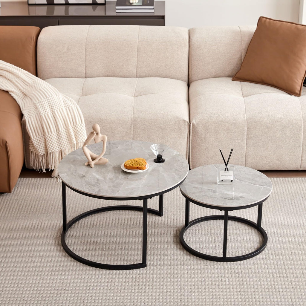 Round coffee table with grey marble top and black metal frame