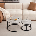 Round coffee table with grey marble top and black metal frame