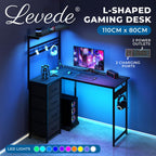 Levede L Shaped Gaming Desk with LED Lights & UK Power Outlets, 110 x 80 cm Reversible Corner PC Desk with 4 Fabric Drawers, Pegboard, CPU Stand & Headphone Hook, Carbon Fibre Black