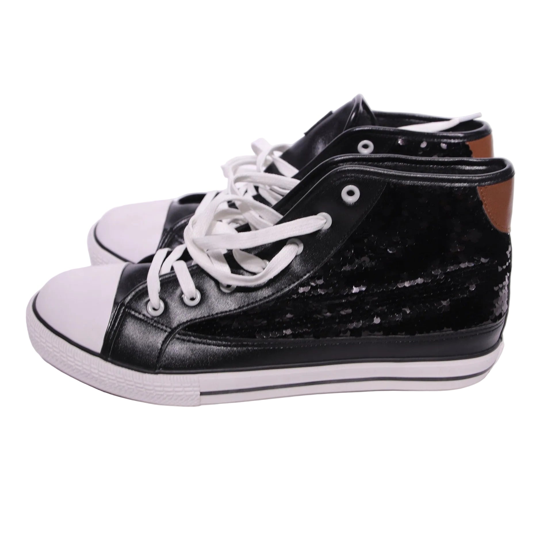 Black high-top sneakers with white laces on a light gray background